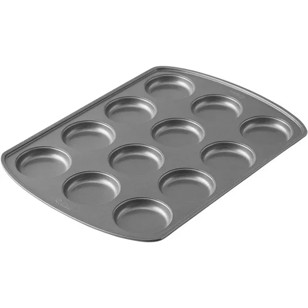 Wilton Perfect Results Premium Non-Stick Bakeware Muffin Top Pan - The Shallow Baking Cups Make Perfect Muffin Tops, Drop Cookies or Whoopie Pie Shells, 12-Cavity, Steel